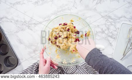 Flat Lay. Step By Step. Mixing Ingredients In A Mixing Bowl To Bake Cranberry Muffins.