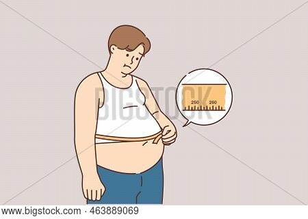 Upset Fat Man Measure Belly With Tape Suffer From Excessive Weight. Unhappy Overweight Male Distress