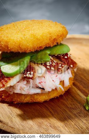 Pan-asian Cuisine Concept. Japanese Sushi Burger Made From Rice Bread, Crab Meat, Avokado And Wasabi