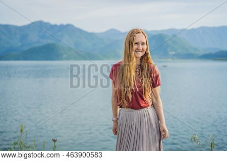 Woman Tourist On Background Of National Park Skadar Lake. Montenegro. Skadar Lake. Dawn. View From A