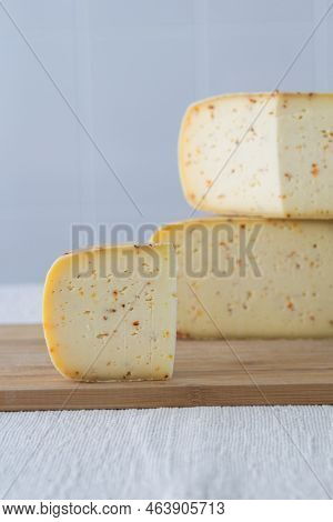 Cutted Round Partmesan Or Pecorino Cheese Head On Wooden Board On Light Background. Fresh Dairy Prod