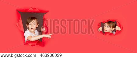 Shocked Child Making Hole In Paper. Kid Looks Through Hole. Blonde Boy Looks Through Ripped Paper. B