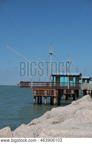 Italy, Marche, Fano: Wooden Constructions On The Water, Called Trabucchi.