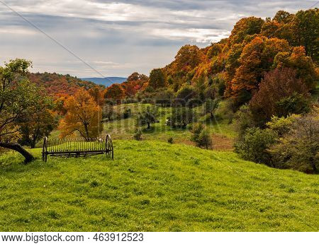Rusty Farm Hay Tedder Implement By Hills Of Autumn Colors In Vermont