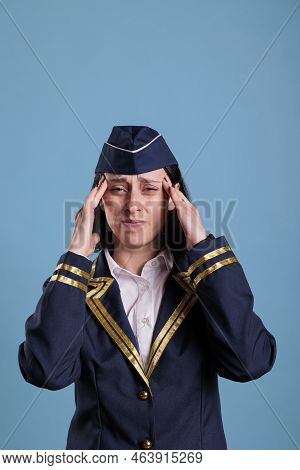 Exhausted Stewardess Having Migraine Symptom, Touching Temples With Fingers, Looking At Camera With 
