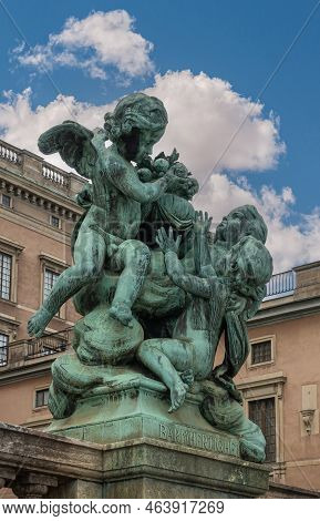 Sweden, Stockholm - July 16, 2022: Royal Palace. Green Bronze Mercy Statue At Edge Of Logarden Along