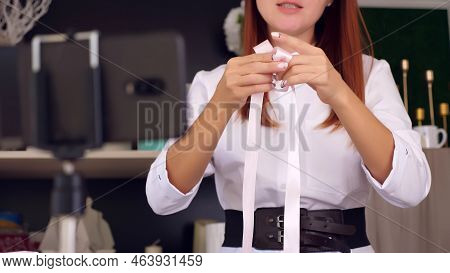 Designer Of Gifts And Decorations Shows How To Tie Bow, Conducts Training Online, Videoconference., 