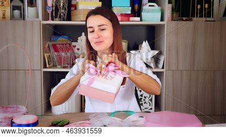 Gifts Wrapping. Attractive Woman, Designer Of Gifts And Decorations Shows Training Online, Records V