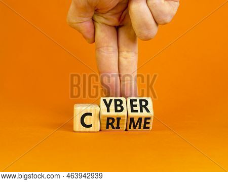 Cyber Crime Symbol. Concept Words Cyber Crime On Wooden Cubes. Businessman Hand. Beautiful Orange Ta