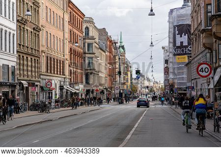 Copenhagen, Denmark - October 18, 2022: People, Cars And Shops On Norrebrogade In Norrebro District
