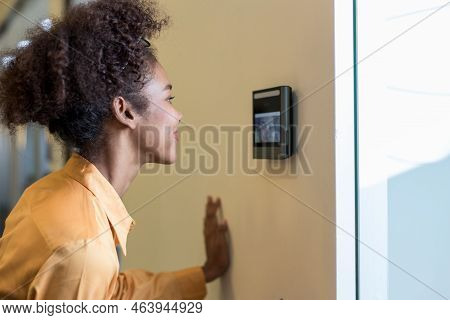 Woman Using Face Scanner To Unlock Door In Office Building. Access Control Facial Recognition System