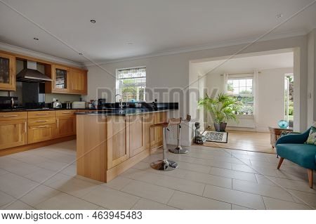 Stradishall, Suffolk, England - June 1 2017 Furnished Modern Kitchen With Breakfast Bar And Stools