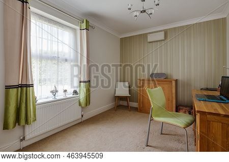 Stradishall, Suffolk, England - June 1 2017 Furnished Modern Home Study With Desk, Chair And Laptop 