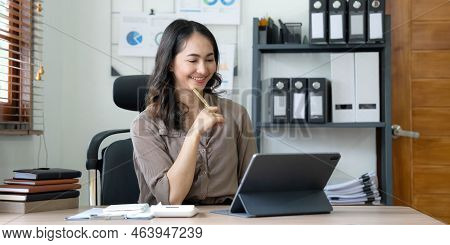 Portrait Of Smiling Beautiful Business Asian Woman Working In Office Use Computer With Copy Space. B