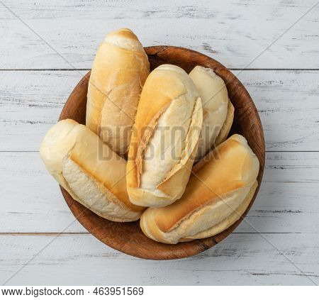 French Bread, Salt Bread Or Pistolet In A Bowl Over Wooden Table.