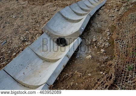 Freeway Bridge Drainage. A Sound-absorbing Wall With Holes Lets Water Through. Gutters Collect Water
