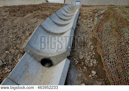 Freeway Bridge Drainage. A Sound-absorbing Wall With Holes Lets Water Through. Gutters Collect Water