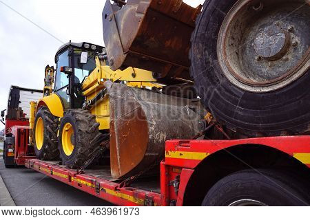 A Truck With A Special Semi-trailer For Transporting Oversized Loads. Transport Of A Huge Bulldozer.
