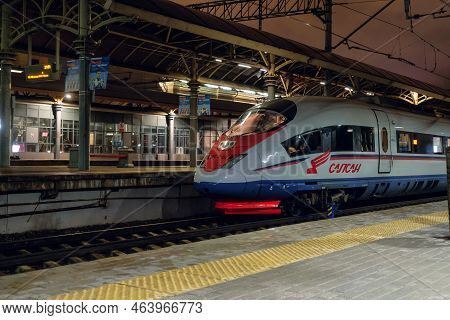 Moscow, Russia - September 03, 2021: Aeroexpress Train Sapsan At Railway Station Stands Near The Pla