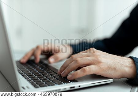 Businessman Typing Recent Updates On Lap Top Keyboard On Desk. Man In Office Writing Important Messa