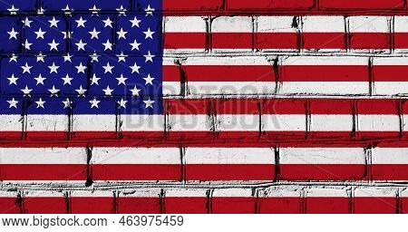 Flag Of The United States Of America On A Brick Wall Texture.