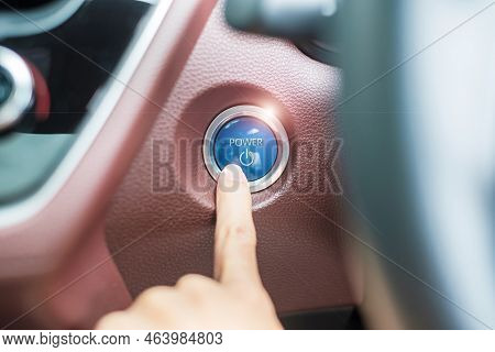 Finger Press A Car Ignition Button Or Start Engine Inside Modern Electric Automobile. Keyless, Chang