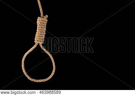 Rope Noose For Hangman, Natural Fiber Rope On Black Background. A Noose Of Hemp Rope For Killing Or 