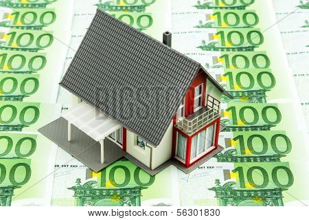 residential house on banknotes, symbolic photo for home purchase, financing, building society