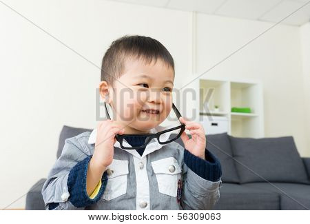 Asian little boy wear glasses
