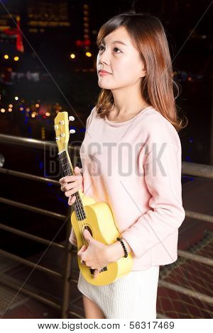 Pretty Asian Woman With Ukelele