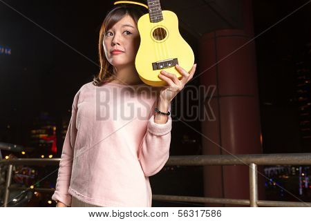Pretty Asian Woman With Ukelele