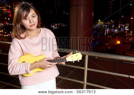 Pretty Asian Woman With Ukelele