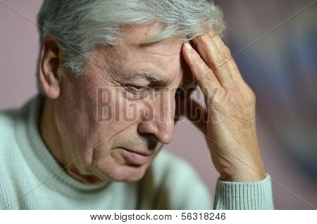 Elderly man thinking