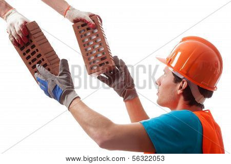 Builder Taking The Bricks