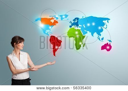 Beautiful young woman presenting colorful world map