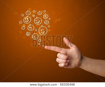 Group of happy hand drawed smiley faces coming out of gun shaped hands