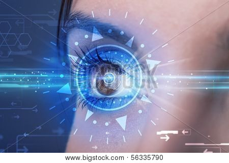 Modern cyber girl with technolgy eye looking into blue iris
