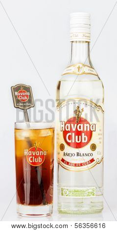 HAVANA,CUBA -?? DECEMBER 25,2013:Havana Club rum bottle and a glass containing a Cuba Libre.Established in 1878 in Santa Cruz del Norte in Cuba, Havana Club is the world's No.3 international rum brand