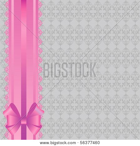 gray background with pattern and pink ribbon.