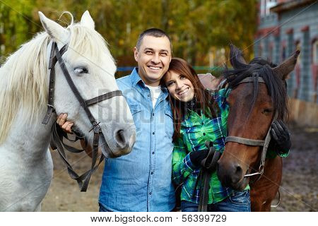 casal com cavalos