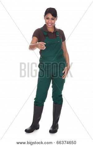 Young Female Gardner Offering Handshake