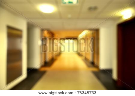 A corridor of a commercial building in perspective. A blurred, bokeh background effect.