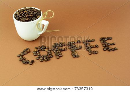 Coffee cup with a bow and coffee bean word