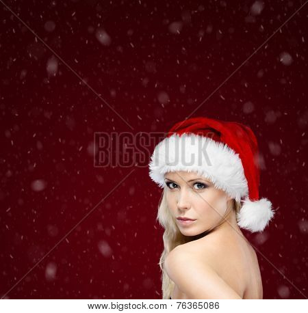 Pretty woman in Christmas cap, purple background
