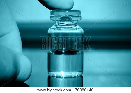 Medical Bottle In Hand.