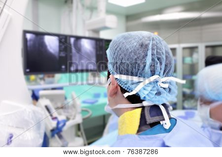 Surgeon In A Special Uniform At Work In The X-ray Laboratory.