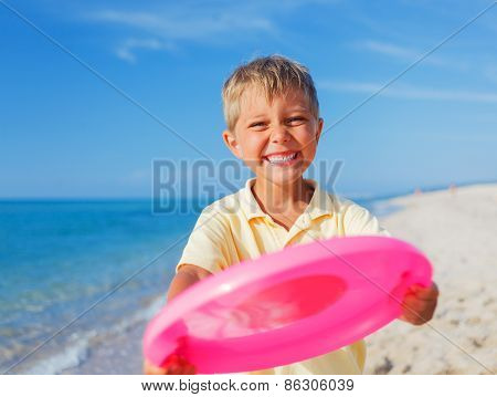 Boy playing frisbee
