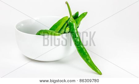 Green Chili Pepper In The Bowl, Isolated On The White Background
