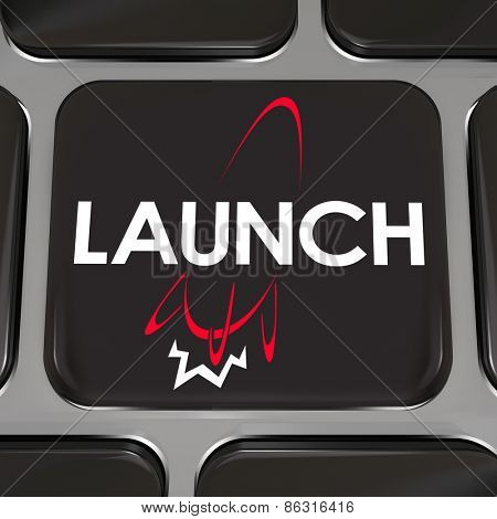 Launch word and rocket ship firing engine taking off into space on a computer keyboard key or button to illustrate starting a new company or business on the Internet