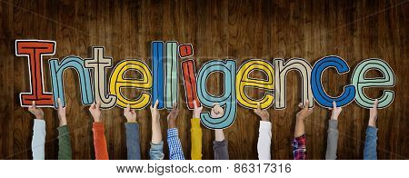 Group of Hands Holding Intelligence Word Concept